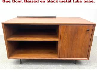 Lot 218 Mid Century Modern Cabinet with One Door. Raised on black metal tube base. 
