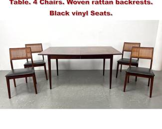 Lot 323 5pc American Modern Walnut Dining Table. 4 Chairs. Woven rattan backrests. Black vinyl Seats. 