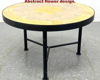 Lot 169 Decorator Iron Base Tile Top Table. Abstract flower design.