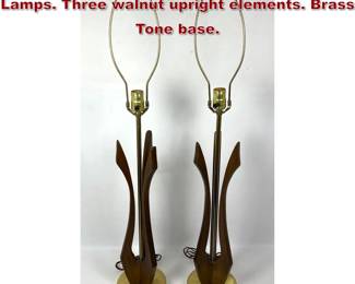 Lot 424 Pr American Modern Walnut Table Lamps. Three walnut upright elements. Brass Tone base. 