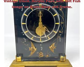 Lot 23 JAEGER LeCOULTRE Marina Vintage Clock. Acrylic Face with Gilt Fish image on Brass Base and Frame. 