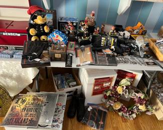 Lots of Harley Davidson items including gloves, scrapbooking, bandannas, window valances, banks, oil stick all related to Harley Davidson .