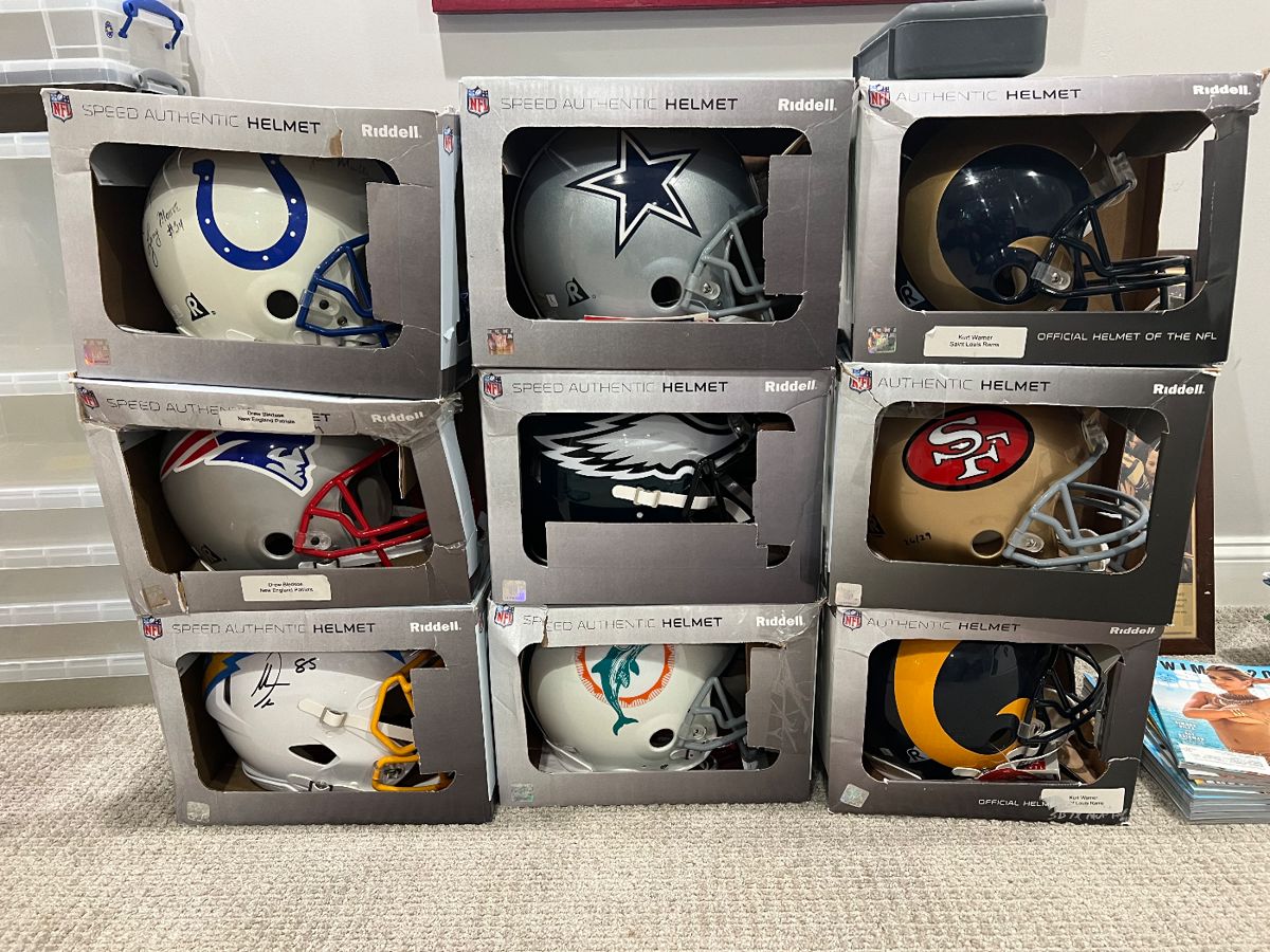 large group of full size NFL helmets signed