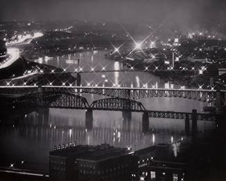 35
Eugene Smith
1918-1978
Untitled [Night View Of River, Bridges, And City Lights]
Gelatin silver print on paper mounted to a board mount
Signed in pencil on the mount, at right: Eugene Smith; inscribed in pencil and with the artist's copyright ink stamp on the mount, verso: 8 Pittsburgh / PT-44-A2
Image/Sheet: 10.125" H x 13.125" W; Mount: 20" H x 16" W
Estimate: $3,000 - $5,000