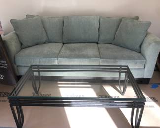 Ultra suede sofa; glass top iron coffee table