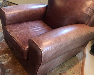 Designer set of 2 arm chairs with ottomans; distressed leather; 4 piece set sold together