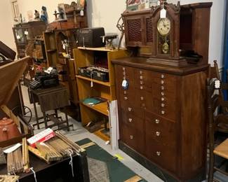 ANTIQUE DENTAL CABINET WITH GREEN WWII AIR FORCE LOCKER COFFEE TABLE IN FOREGROUND