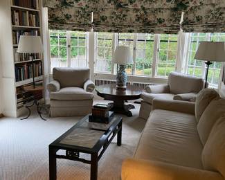 Pair of upholstered chairs, sofa, Asian styled coffee table, lot of books, lamps, tables