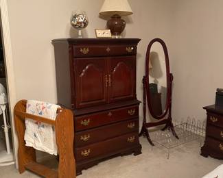 armoire , quilt rack and stand up oval mirror, large glass bowl with matches, lamp, alarm clock