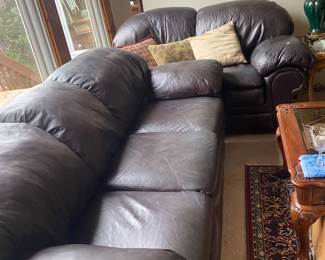 genuine leather couch and love seat burgandy is what tag says, but looks brown in great condition 