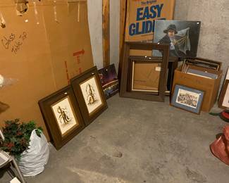 Glass tabletop on good, glider, artwork and frames 