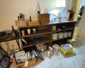 I’m going to tell you right now that this bookcase is super heavy but it’s solid wood with a nice laminate on top. If we got it in this room, you can get it out! Sunday special