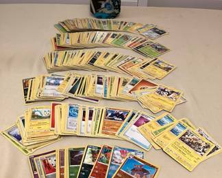 CCS174 Over 500 Pokémon Trading Cards In Storage Tin