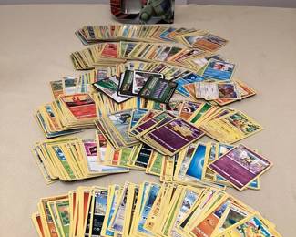 CCS175 Over 600 Pokémon Trading Cards In Storage Tin