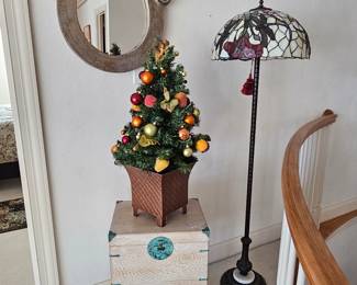 Small Christmas tree on Oriental chest with Stained Glass floor lamp