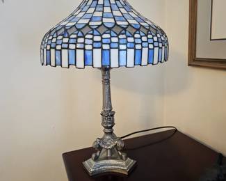 Stained glass lamp with blues and white and bronze base