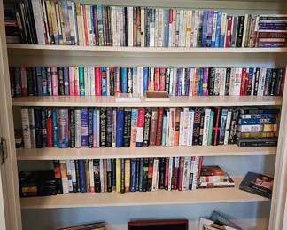 Tons of books - both hardbacks as well as softbacks. Vinyls, coin collection wooden case