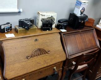 Drop front writing desks. With large camera collection