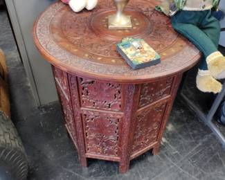 Hand carved mahogany end table. Collapsible