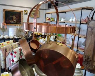Copper pots and pans. And copper pot rack.