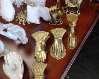 Brass Victorian hand paper clips.