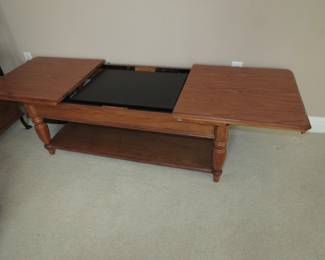 Coffee table that opens to convert to a TV stand