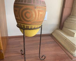 Pottery in metal stand