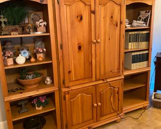 Nice light wood three piece entertainment center. 