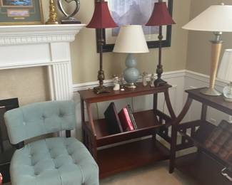 Side table with book display shelf, lamps, side chairs