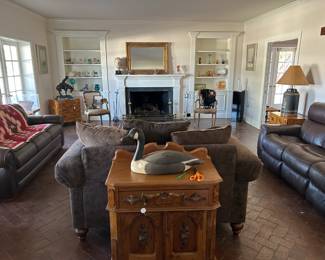 Lots of treasures in the living room, comfy sofas, decoys, custom chests, and a vintage oak wash stand with decoy.