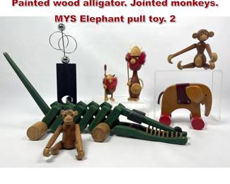 Lot 1073 Mid Century Mostly Wood Toys Lot. Painted wood alligator. Jointed monkeys. MYS Elephant pull toy. 2 