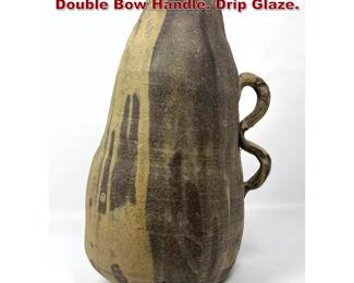 Lot 884 Large Studio Pottery Vase with Double Bow Handle. Drip Glaze. 