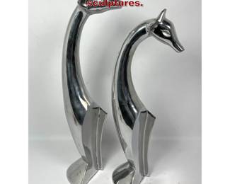 Lot 698 2pcs Aluminum Giraffe table sculptures. 