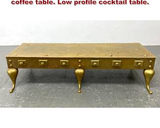Lot 928 Hollywood Regency brass footman coffee table. Low profile cocktail table. 