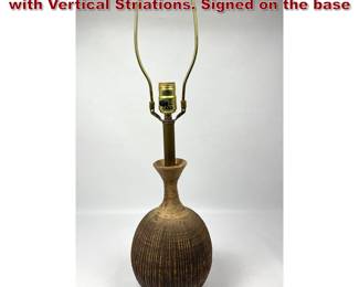 Lot 881 Glazed Earthen Studio Pottery Lamp with Vertical Striations. Signed on the base