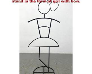 Lot 1032 Child s wire clothing mannequin stand in the form of girl with bow. 