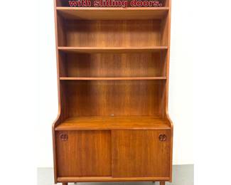 Lot 810 Danish Modern bookcase cabinet with sliding doors.