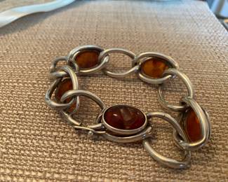 #78  - Sterling bracelet with 5 amber cabochon - one amber cabochon is damaged $100 as is 