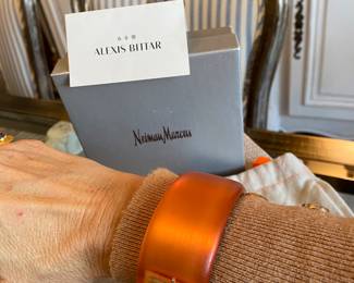 #49 Alexis Bittar orange lucite cuff (7" diam) with rhinestine - with original felt bag and Neiman and Marcus box.  $130