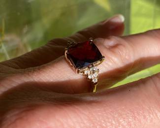 #93 - 14kt yellow gold ring, red faceted stone, size 6.5, $250.