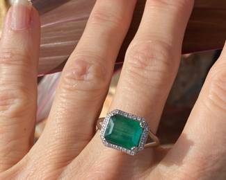 #4 -  White gold 10kt custom setting from Bere. Emerald cut emerald 3.03 cts, diamond bezel, $2,895 