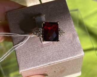 #93 - 14kt yellow gold ring, red faceted stone, size 6.5, $250.