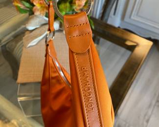 #59 - Longchamps orange satin purse - 2 inside zipper pockets - very good condition - $90