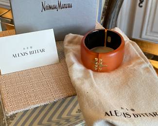 #49 Alexis Bittar orange lucite cuff (7" diam) with rhinestine - with original felt bag and Neiman and Marcus box.  $130