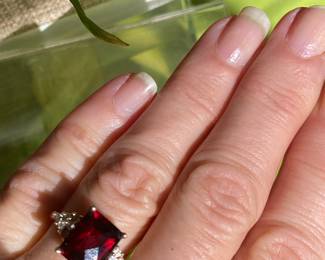 #93 - 14kt yellow gold ring, red faceted stone, size 6.5, $250.