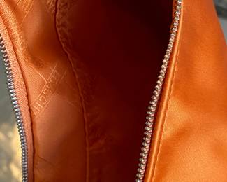 #59 - Longchamps orange satin purse - 2 inside zipper pockets - very good condition - $90