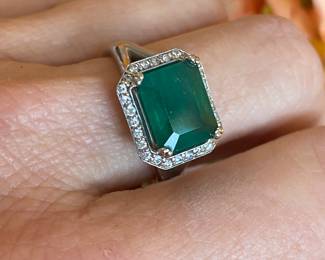 #4 -  White gold 10kt custom setting from Bere. Emerald cut emerald 3.03 cts, diamond bezel, $2,895 