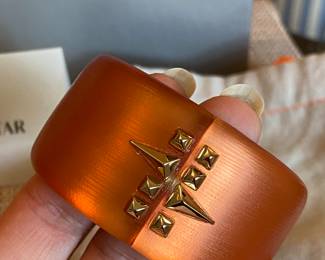 #49 Alexis Bittar orange lucite cuff (7" diam) with rhinestine - with original felt bag and Neiman and Marcus box.  $130