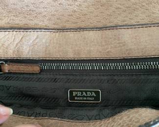 #99 - Prada small handbag leather light brown purse 	$100 - Clean condition but used. 