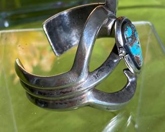 #86 - $150 Unsigned/unmarked Arts & Crafts handcrafted silver bangle with turquoise. 